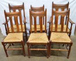 Set of six oak Arts & Crafts dining chairs together with an oak windout dining table with two