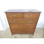 Warings oak chest of two short and three long crossbanded drawers with brass handles, standing on