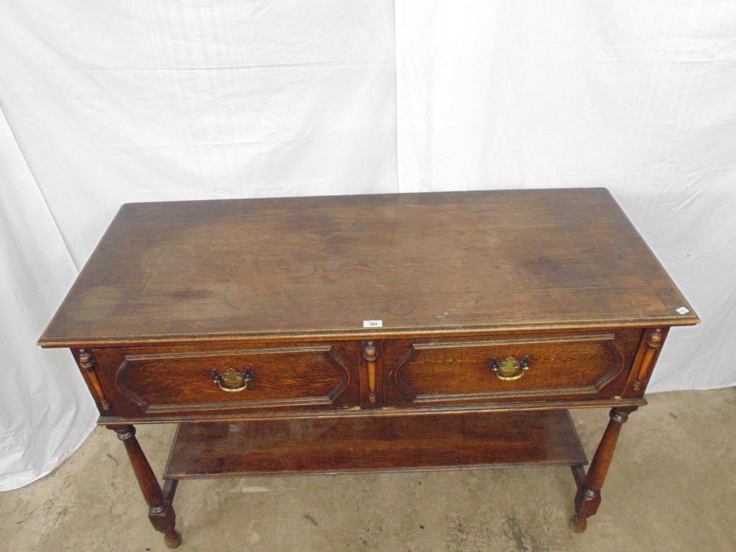 Oak dresser base having two drawers with brass handles on turned front legs leading to lower - Image 2 of 2