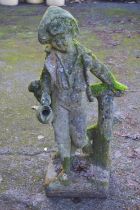 Weathered 20th century statue of a young boy holding a jug and standing by a fence - 31" tall Please