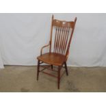 Oak American bentwood spindle back chair with turned finials, bow fronted seat, standing on turned