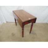 Victorian mahogany Pembroke table with single drawer and knob handle, standing on turned legs ending