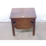 Oak commode having lift up top opening to reveal storage space with shaped sides, standing on square