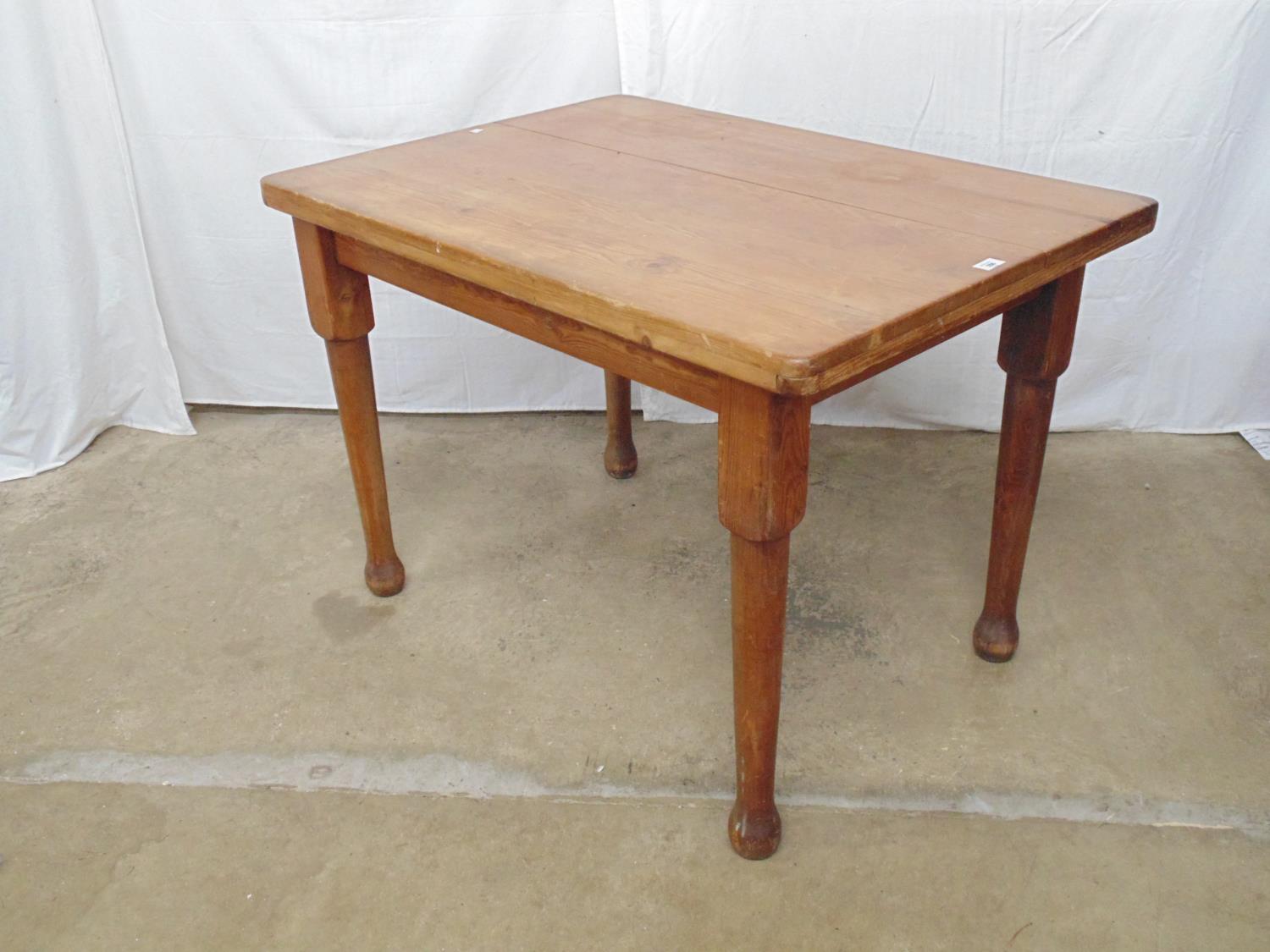 Pine kitchen table having solid five plank top standing on tapering legs - 41" x 29.5" x 28.75" tall