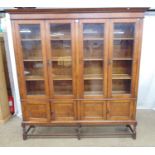 Glazed oak four door bookcase on cupboard base with barley twist stretchered legs - 72.5" x 15" x