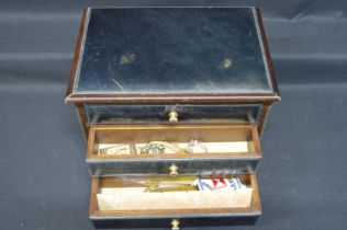 Three drawer jewellery box containing a quantity of costume jewellery Please note descriptions are