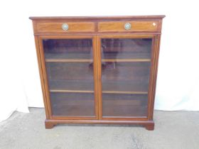 Inlaid mahogany glazed display case having two drawers over two doors enclosing two shelves,