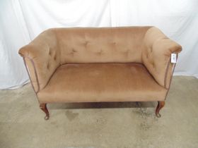 Upholstered button back two seater settee standing on cabriole legs to the front and shaped legs