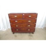 Mahogany military style chest of three long and two short drawers, two brass carrying handles to