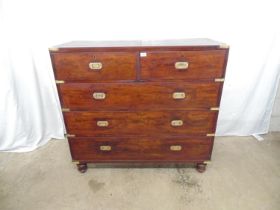 Mahogany military style chest of three long and two short drawers, two brass carrying handles to