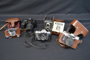 Quantity of cameras to comprise: Halina Viceroy box camera, Zenit-E, Yashica FX-D, Kodak Retina
