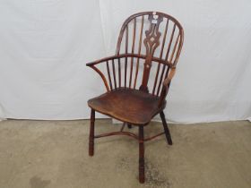 19th century yew wood and elm Windsor chair with stick back, standing on turned legs with