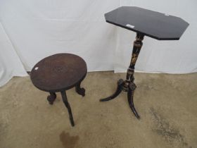 Ebonised and gilt tilt top occasional table standing on a turned column with splay legs having lions