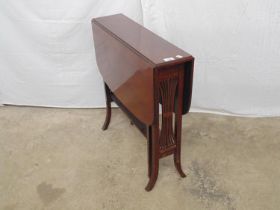 Mahogany Sutherland table having lyre ends leading to slender second tier, standing on splayed