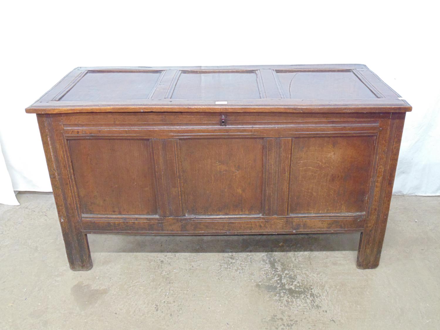 19th century oak coffer having three panel top and front, standing on square legs - 51.25" x 22.5" x