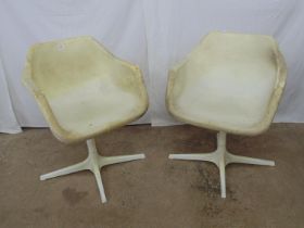 Pair of white/cream plastic tub chairs, standing on column leading to four feet - 23.5" x 29.75"