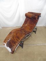 Corbusier style chaise longue on chrome plated frame and upholstered in cow hide with sled base