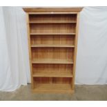 Pine bookcase with one fixed and four adjustable shelves, standing on plinth base - 44.25" x 12.5" x