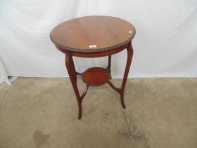 Mahogany two tier circular occasional table having rope twist decoration to edge, standing on