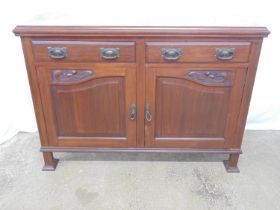 Mahogany Art Nouveau style sideboard with two short drawers over carved two door cupboard,