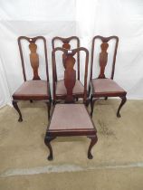 Set of four mahogany dining chairs having shaped cresting rails and back splats, upholstered