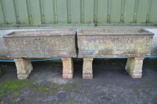 Pair of reconstituted terracotta colour trough planters on stands - 46" and 46.5" x 15" x 31.5" tall