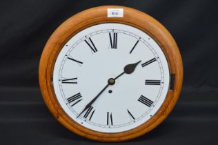 Oak cased circular clock having fusee movement, white plastic dial and Roman Numerals - 15.25"