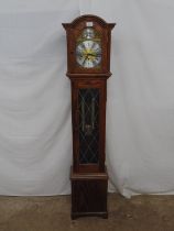 Modern Fenclocks oak cased grandmother clock the arched hood enclosing a brassed and silvered dial