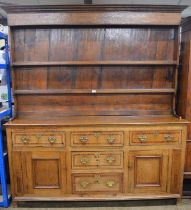 Georgian oak canopy top dresser the plate rack having two shelves, inverted waterfall front and