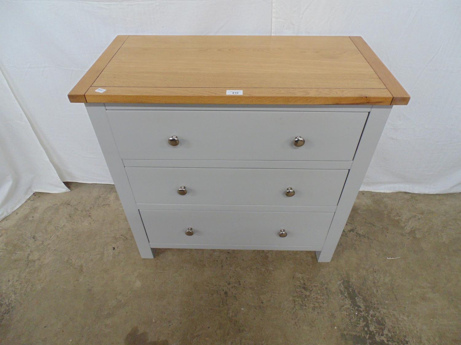 Modern oak top chest of three drawers with grey finish to base, having three long drawers with