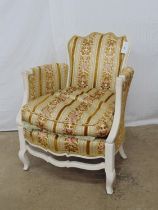 French style painted armchair standing on shaped legs and having floral gilt upholstery to seat,