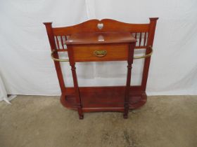 Mahogany hall stand having central drawer flanked by umbrella stands with turned columns leading