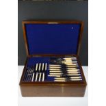 Late Victorian oak cased canteen of cutlery, with three tiers of cutlery containing approx 97 items,