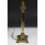 Cast brass Corinthian column table lamp base, raised on four bracket feet, approx 50cm high