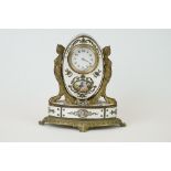 An antique Brass and enamel table clock, hinged top reveals trinket box with gilt lined interior,