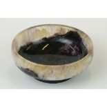 A carved Blue John trinket dish, measures approx 7cm in diameter.