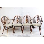 Set of Four Ercol Dining Chairs in the Fleur De Lys pattern (including two carvers) with seat