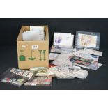A collection of British & world stamps, mostly loose examples together with a flowers &views from
