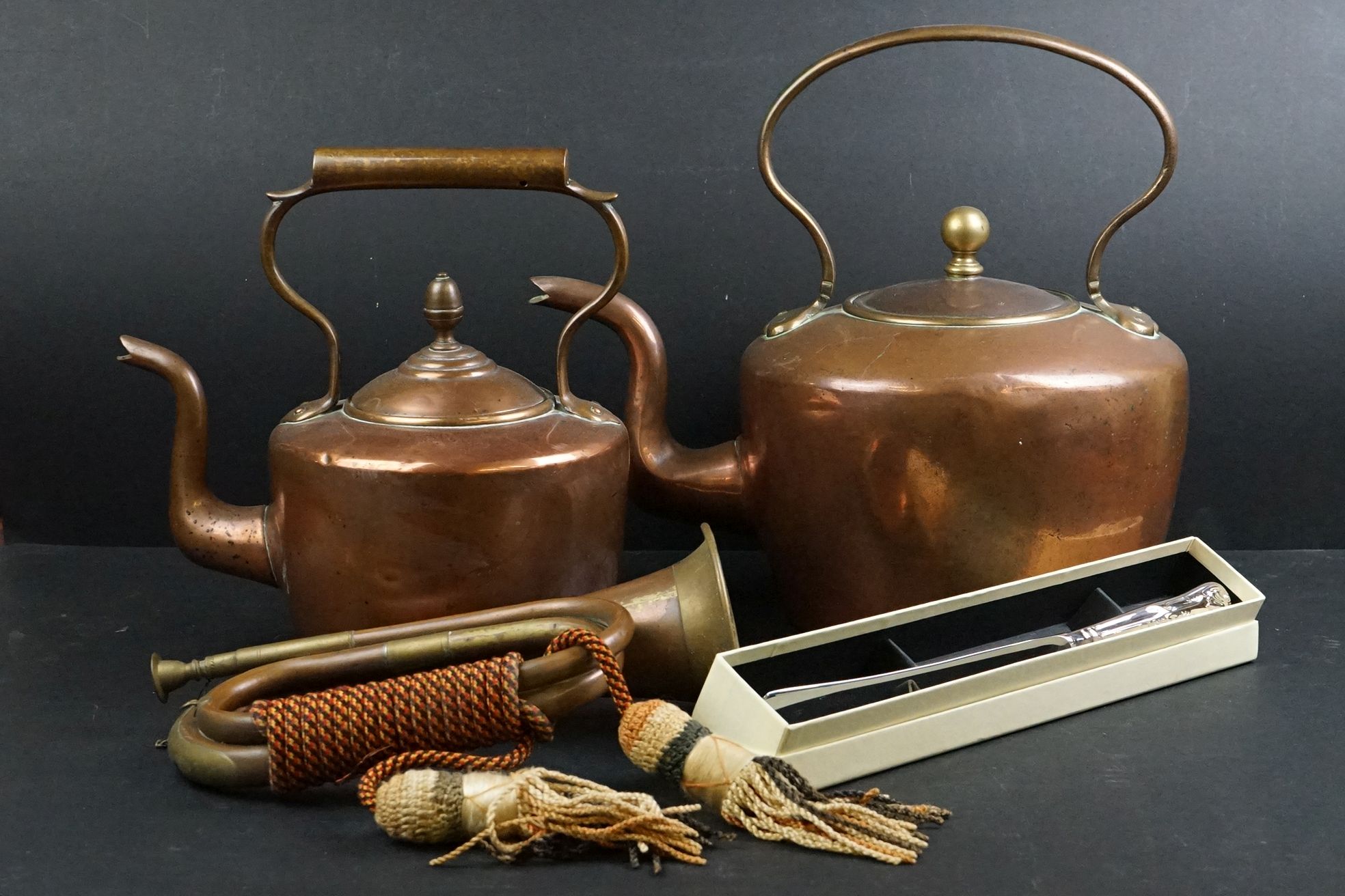 A small group of mixed collectables to include to copper kettles, a copper bugle and a silver plated