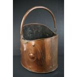 Early 20th Century Arts & Crafts copper swing handled coal scuttle, by Townshends Ltd, with embossed