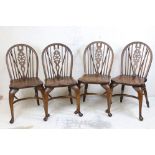 Set of Four Elm Seated Windsor Wheelback Dining / Kitchen Chairs raised on cabriole front legs