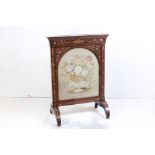 19th century Rosewood Firescreen with floral and foliate marquetry inlay, the arched glazed panel