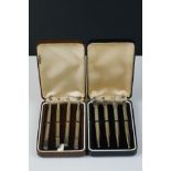 Two cased sets of four sterling silver bridge pencils with card suit finials.