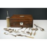 A collection of fully hallmarked sterling silver items to include a table brush, two caddy spoons,