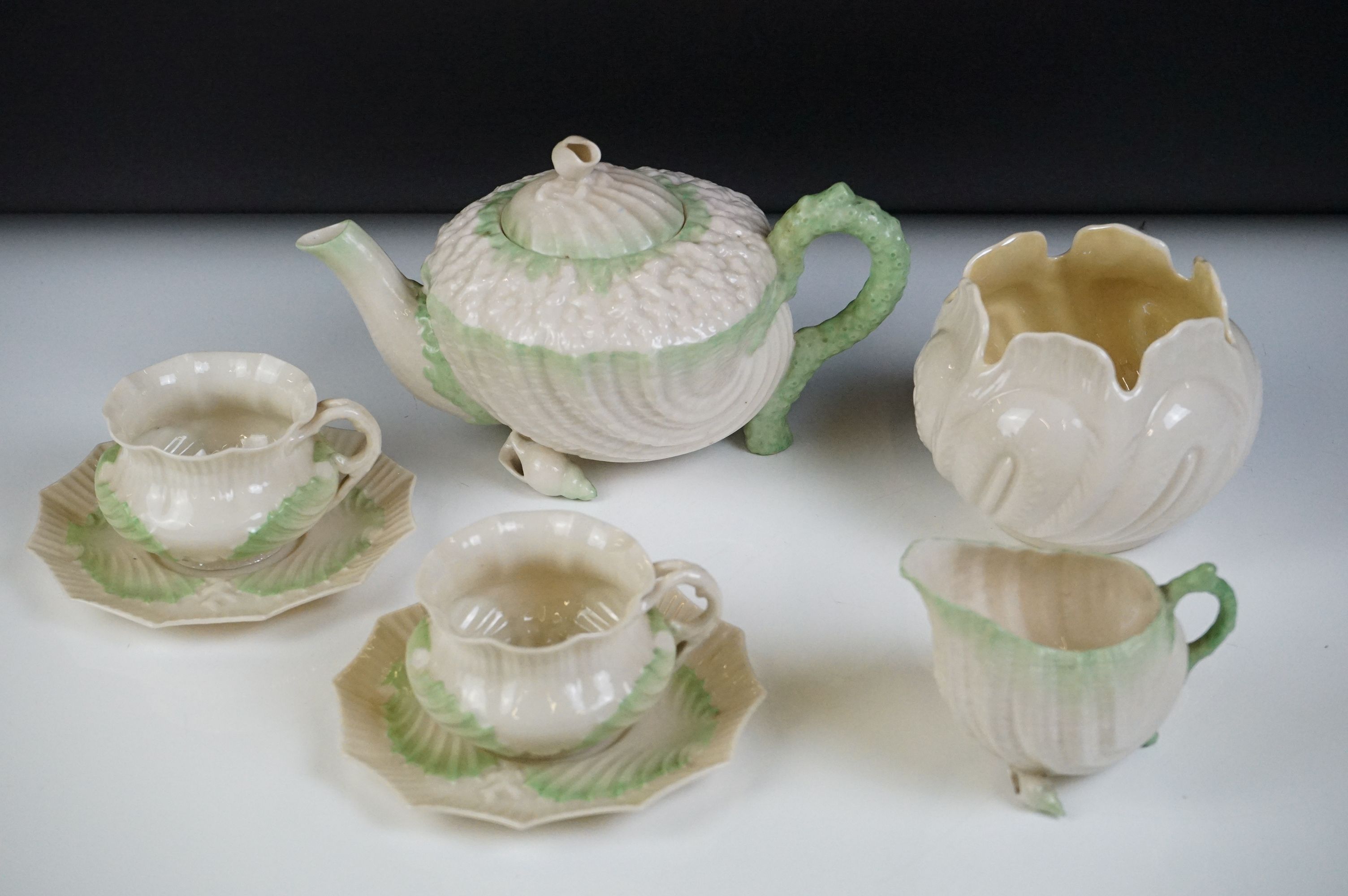 Belleek porcelain tea ware comprising Green Neptune pattern (teapot & cover and milk jug), 2 teacups