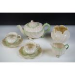Belleek porcelain tea ware comprising Green Neptune pattern (teapot & cover and milk jug), 2 teacups
