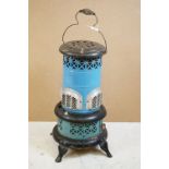 Valor 650-R blue enamel metal paraffin heater of pillar form, raised on four feet, with carry