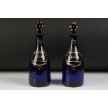 Pair of 19th Century Bristol Blue glass decanter bottles with stoppers to include Rum and Shrub,