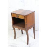 French style Mahogany Side Cabinet with single drawer over an open shelf, raised on sabre front