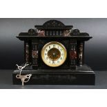 A large antique french slate mantle clock with marble decoration and white dial.